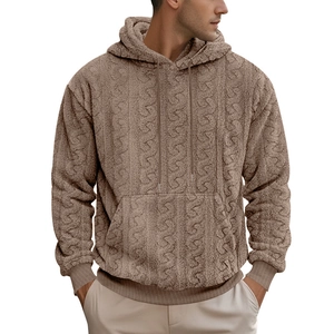 Detail of men's brown teddy fleece hoodie featuring intricate cable knit texture and drawstring