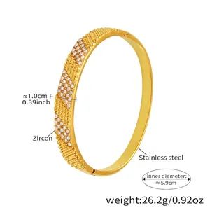 Detail showing 1.0cm width and 5.9cm inner diameter of gold zircon stainless steel bangle