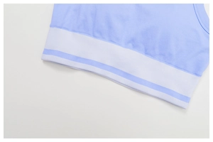 Close-up of seamless yoga vest showing light blue knit fabric and white striped elastic band