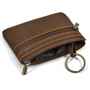 Detail view of dark brown crazy horse leather coin purse with double zipper and key ring