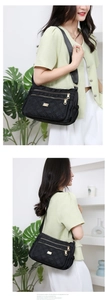 Quilted black nylon crossbody bag featuring a multi-pocket design and golden zippers