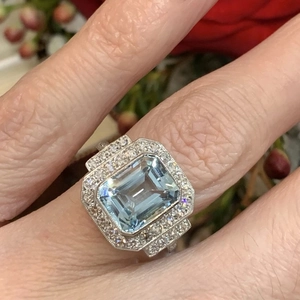 Art Deco emerald cut aquamarine zircon ring with sparkling double halo of small stones