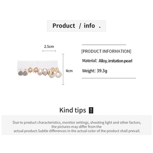 Detailed view of alloy earring set with imitation pearl charms and floral designs