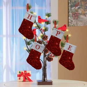 Red sequin Christmas stockings with HOPE letter embroidery hanging on a festive tree