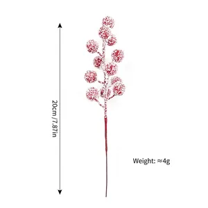 Detail of a 20cm artificial red berry stem with snow effect for festive holiday decor
