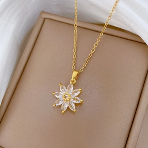 Detailed macro view of an eight-petal flower pendant necklace with sparkling crystals