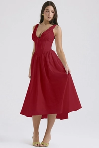 Close-up detail of the deep V-neckline and slim waist on this red summer maxi dress