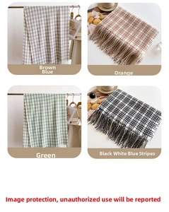 Assorted plaid cashmere-feel scarves with fringe tassels in brown, orange and green tones