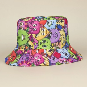 Detailed view of colorful graffiti monster print on a double-sided bucket hat surface