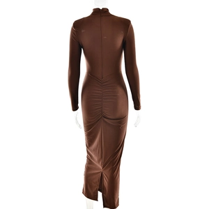 Detailed back view of a brown long sleeve dress with ruched texture and slit hem detail