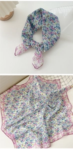 Detailed view of floral cotton linen neckerchief with elegant pink wavy scalloped edges