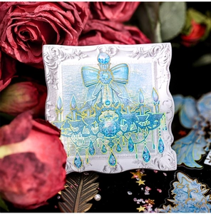 Detailed view of blue crystal chandelier sticker with laser effect on floral background