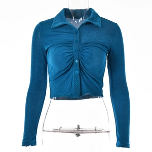 Detail of navy blue ribbed knit cardigan with buttoned polo collar and pleated chest design