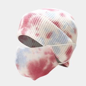 Close-up of pink and blue tie-dye knit beanie hat and matching face mask set