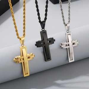 Detailed view of cross pendants in gold, black and silver finishes with rope chains