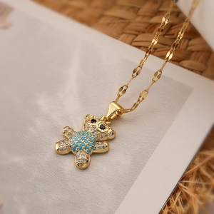 Gold plated bear pendant necklace with turquoise and zircon stones on lip chain