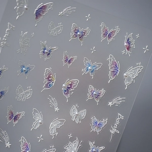 5D butterfly embossed nail stickers with blue-purple gradients and pearl accents