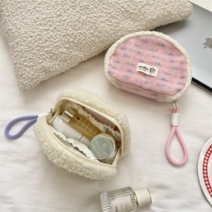 Interior view of plush shell cosmetic bag set with elastic organizers and soft texture