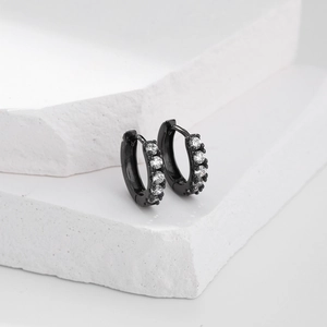 Macro shot of black sterling silver hoop earrings with white micro-pave cubic zirconia