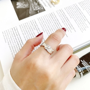 Irregular textured S925 sterling silver ring with a sparkling round zircon stone