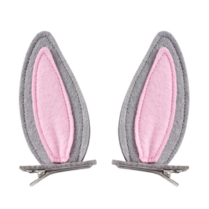 Detail of grey and pink felt bunny ear hair clips with silver metal crocodile clips