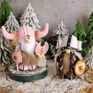 Viking gnome figurines in pink and black-white themes on a snowy winter forest background