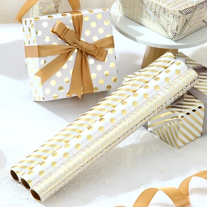 Gold and white pattern gift wrapping paper rolls for Valentines Day and birthdays
