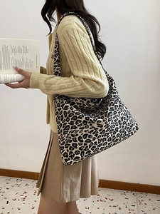 Large capacity leopard print canvas tote bag styled with casual outfit for daily wear