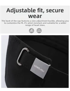 Detail of adjustable metal buckle and strap on the back of the black baseball cap
