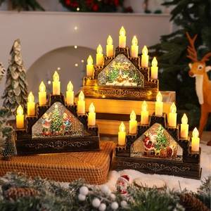 Detail of vintage bronze Christmas candle bridge with Santa Claus and warm LED light
