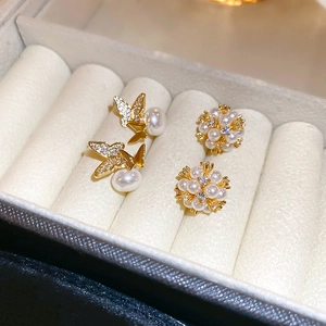 Elegant gold-plated butterfly and flower pearl stud earrings with sparkling zircons