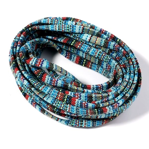 Detailed close-up of 5mm braided cotton cords with colorful ethnic geometric patterns
