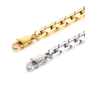 Detail of gold and silver stainless steel chain links with lobster clasps and logo