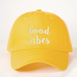 Classic bright yellow cotton baseball cap featuring Good Vibes white embroidery