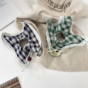Lace-trimmed checkered scrunchies with cherry prints and fruit charms on linen background