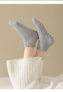 Thick grey coral fleece floor socks with purple silicone anti-slip grippers on soles