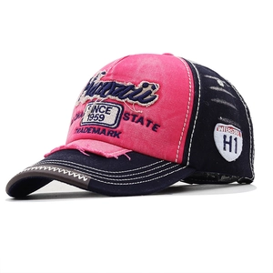 Detail of vintage baseball cap with Hawaii 3D embroidery and distressed brim edges