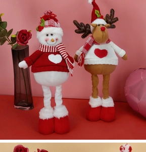 Detail of knitted Christmas gnome dolls featuring snowman and reindeer with long legs