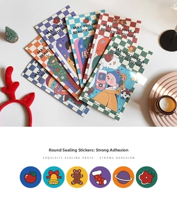 Close-up of various round Christmas stickers with festive cartoon patterns for gift sealing