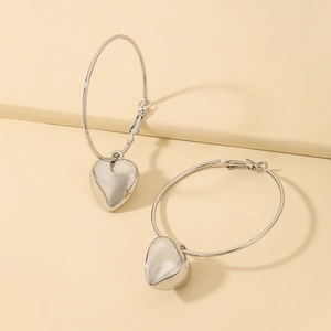 Minimalist silver hoop earrings with heart charms and a polished mirror finish for women