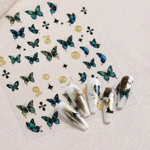 Detailed view of teal steampunk butterfly nail stickers on ice-transparent nails
