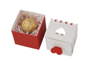 Detail of red and white heart-shaped gift boxes with cutout lids for Valentine sweets