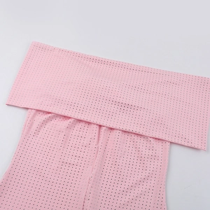 Detailed macro view of pink fabric with sparkling silver rhinestones on elegant dress