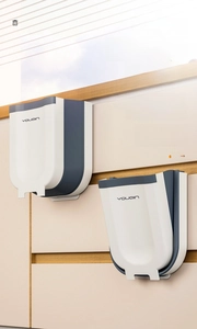 Foldable kitchen trash can showing collapsed and expanded states for cabinet hanging