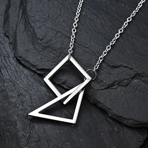 Minimalist silver geometric interlocking triangle square titanium necklace on black stone