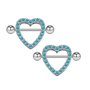 Close-up of heart-shaped silver nipple rings with inlaid blue crystals on white background