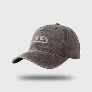 Distressed charcoal gray baseball cap with white letter D embroidery in a vintage style