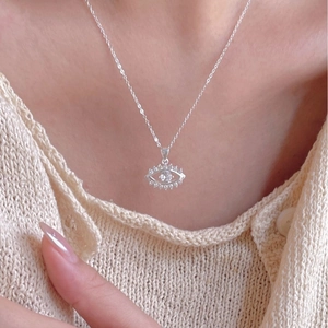 Minimalist 925 sterling silver evil eye necklace with zircon stones on female model