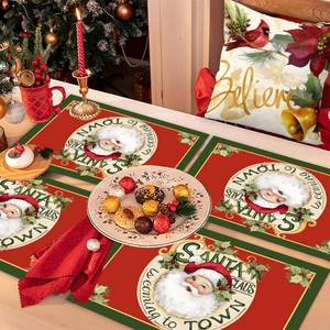 Festive Santa Claus placemat and cushion set on a decorated Christmas table