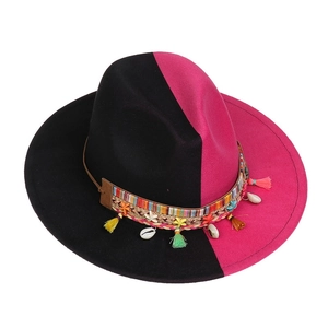 Detail of felt fedora with ombre gradient and bohemian shell tassel hatband